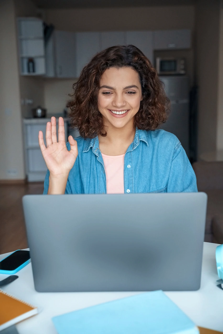 A woman participates in teletherapy.