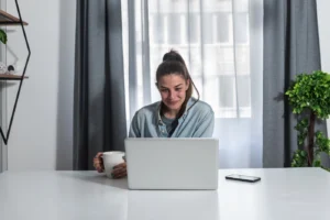 A woman participates in teletherapy.
