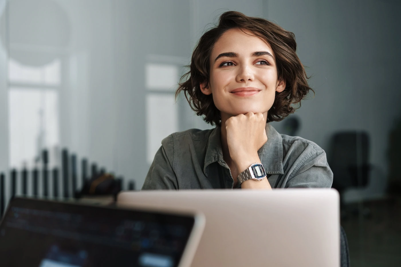 A woman participates in online therapy.